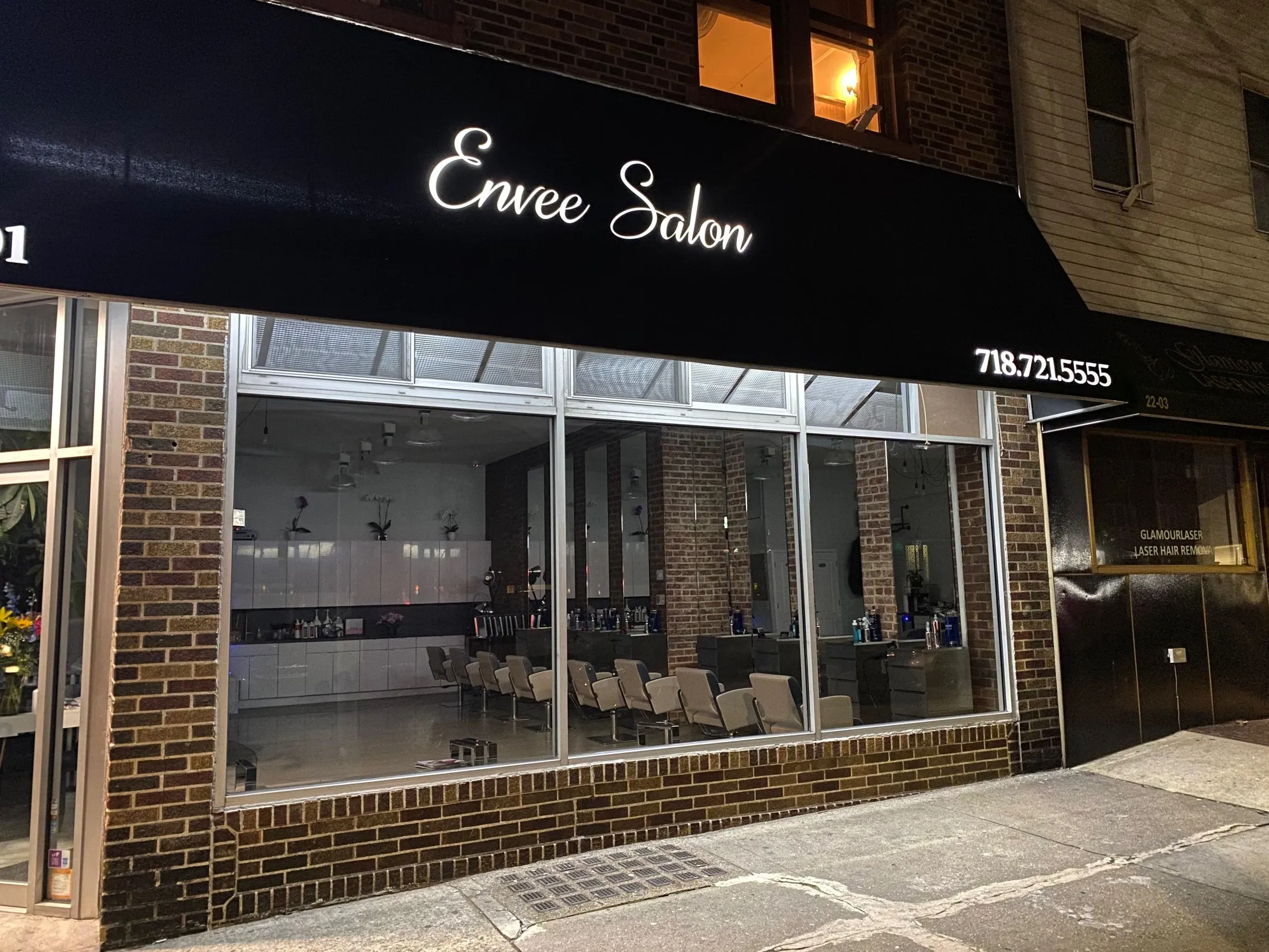 Envee Salon illuminated awning at night