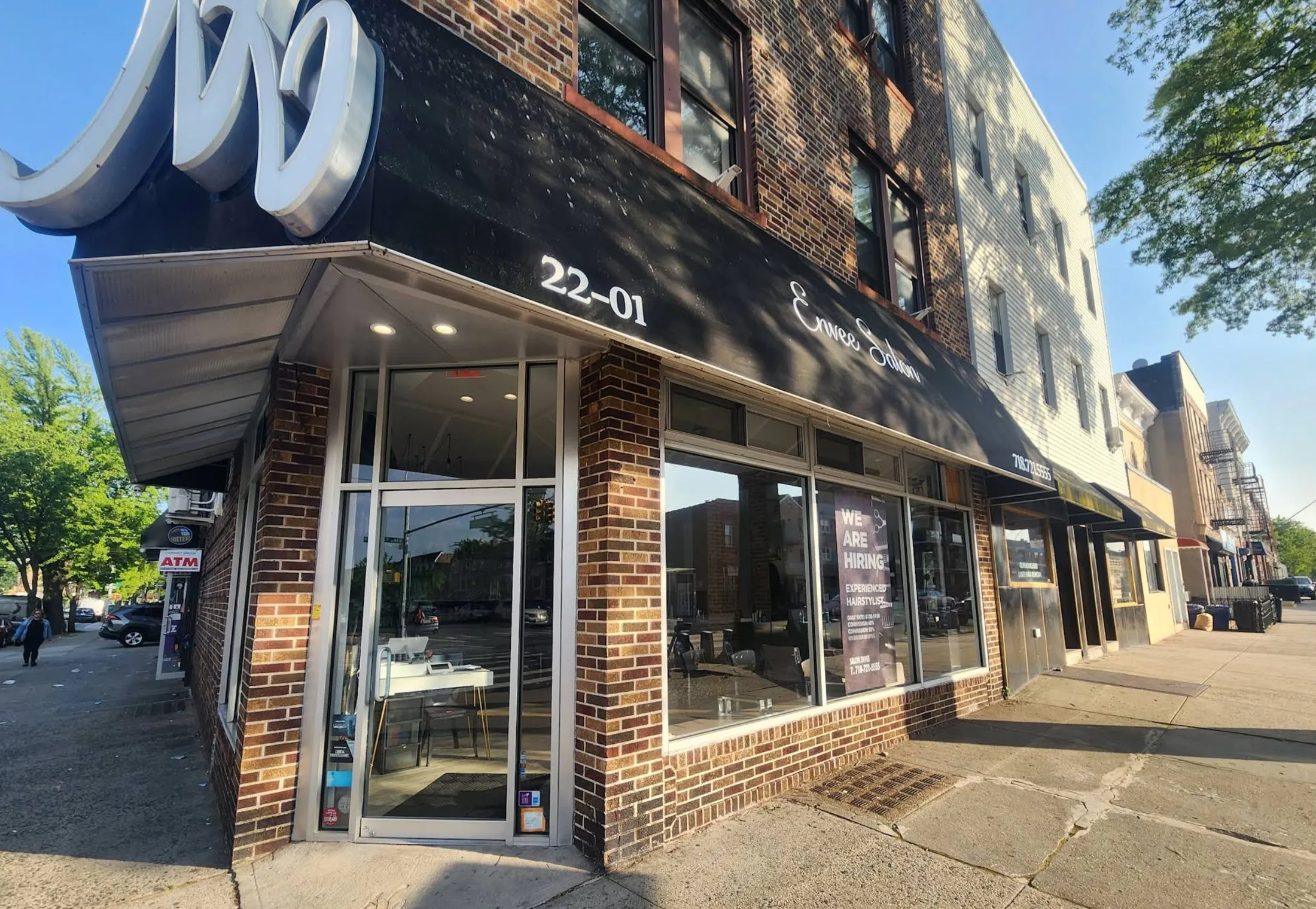 Envee Salon storefront on Steinway Street, Astoria by day